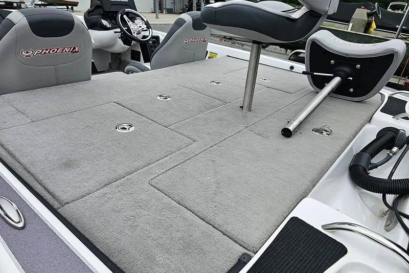 Slide: The Image of 2018 Phoenix 921 ProXP boat interior with gray carpet and seating. - 6