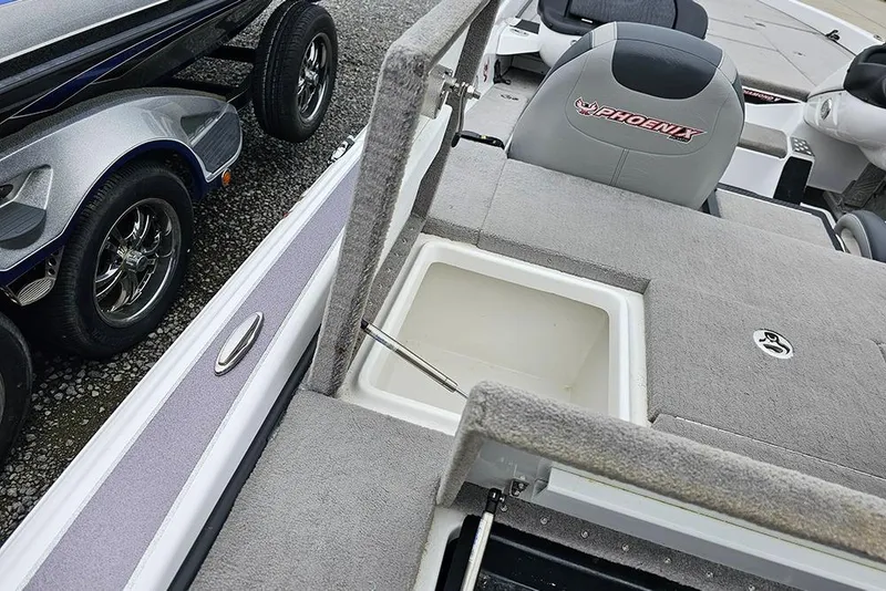 Slide: The Image of 2018 Phoenix 921 ProXP boat interior with storage compartment and seating. - 8