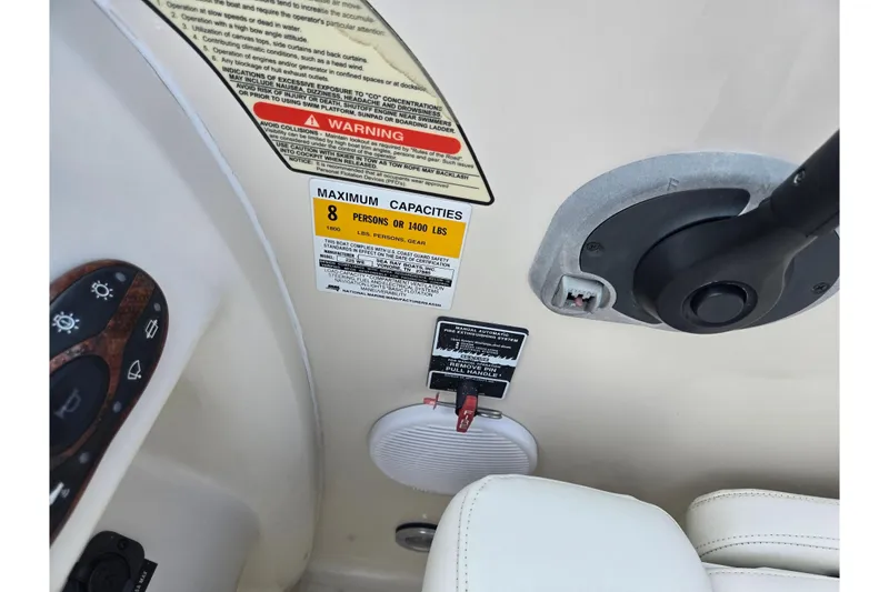 Slide: The Image of Interior of 2002 Sea Ray 225 Weekender showing capacity and safety labels. - 13