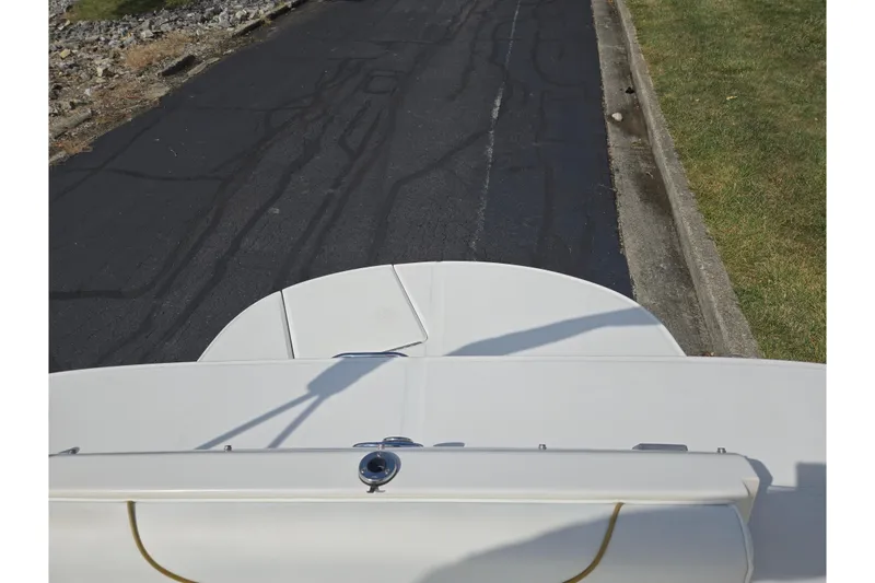 Slide: The Image of Top view of a 2002 Sea Ray 225 Weekender boat on a paved road. - 22