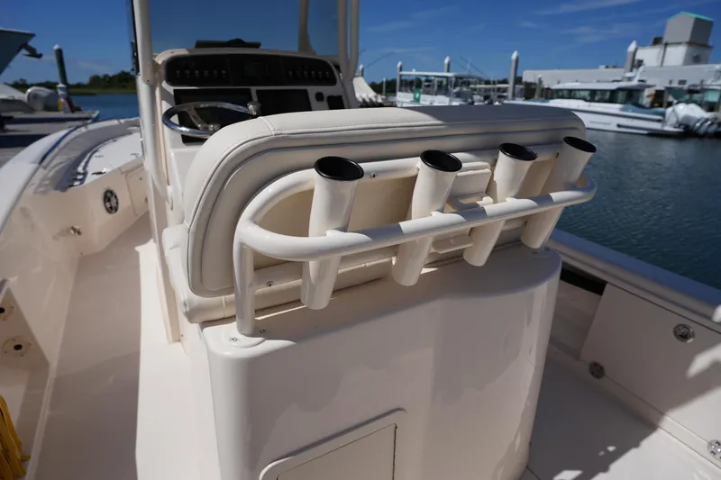 Slide: The Image of 2024 Grady-White 251 Coastal Explorer boat interior with rod holders and console. - 23