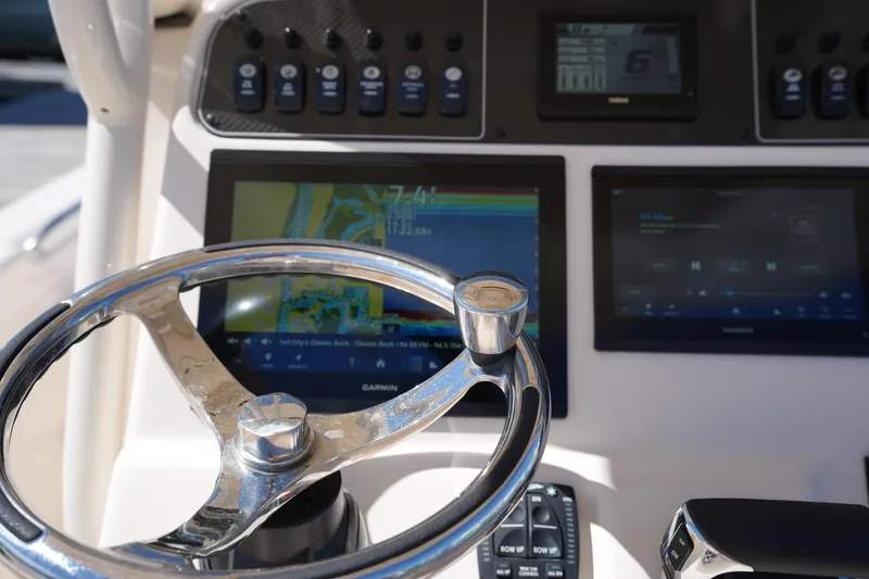 Slide: The Image of 2024 Grady-White 251 Coastal Explorer helm with advanced navigation displays. - 28