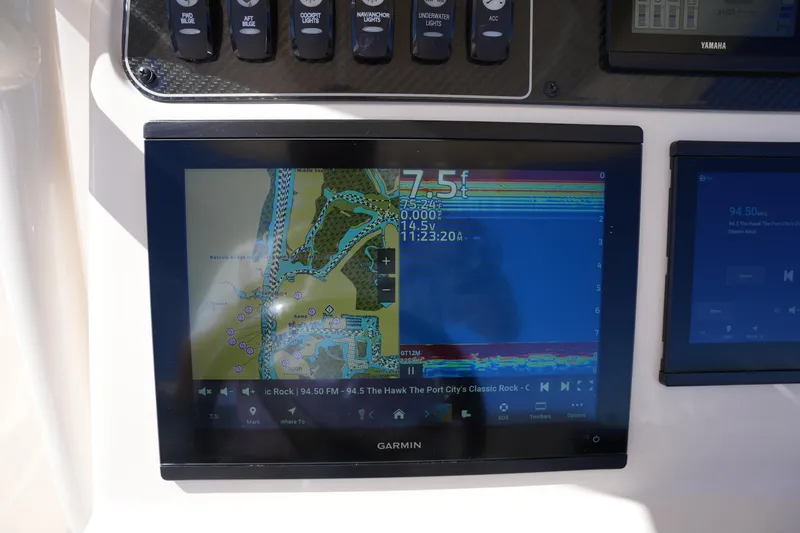 Slide: The Image of Garmin navigation display on 2024 Grady-White 251 Coastal Explorer boat dashboard. - 33