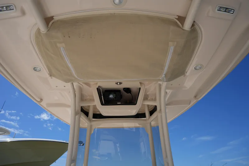 Slide: The Image of 2024 Grady-White 251 Coastal Explorer boat interior roof view under clear sky. - 34