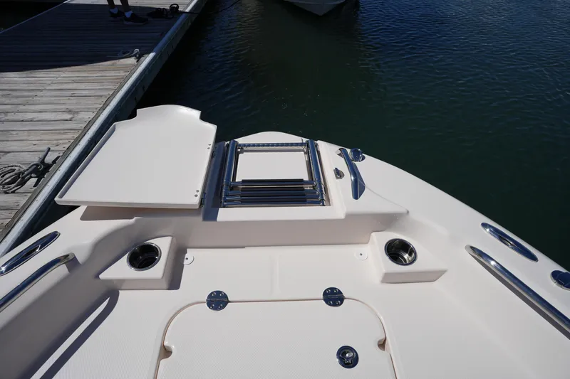 Slide: The Image of 2024 Grady-White 251 Coastal Explorer boat deck with stainless steel fittings and storage compartments. - 39