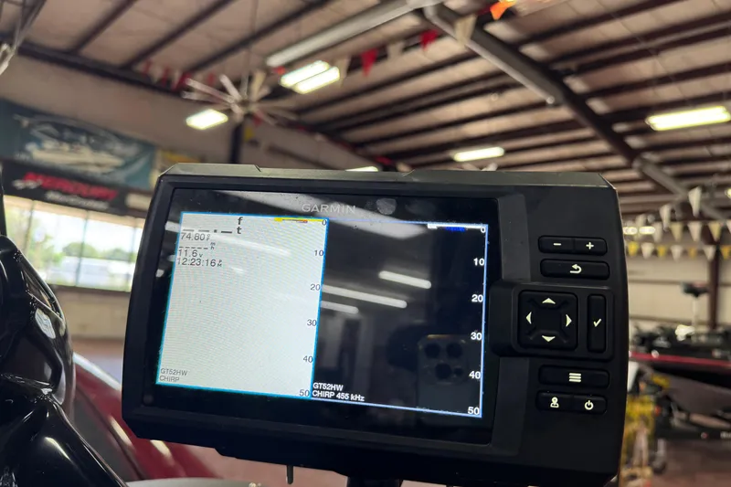 Slide: The Image of Garmin fishfinder display on 2021 Bass Tracker Pro Team 195 boat in showroom. - 2