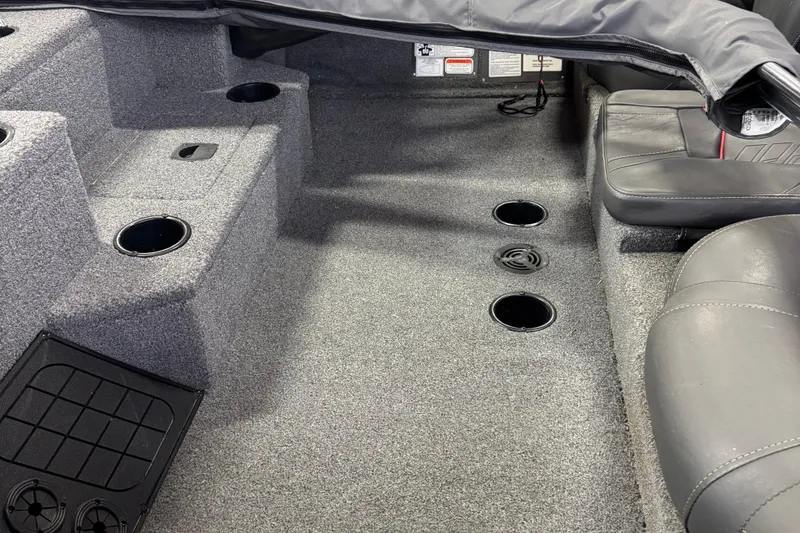 Slide: The Image of Interior of 2021 Bass Tracker Pro Team 195 boat with carpeted flooring and seating. - 3