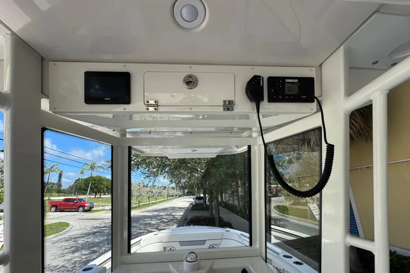 Slide: The Image of Interior view of 2026 Sailfish 252 boat with navigation equipment and street view. - 14