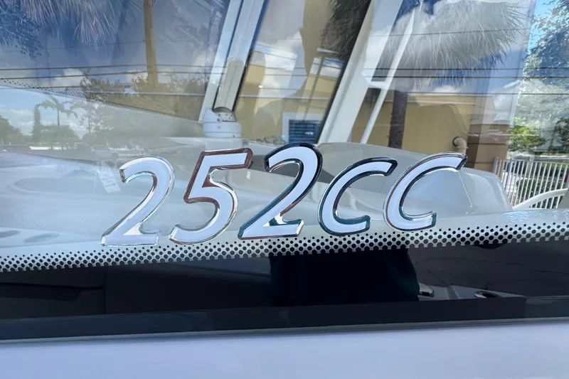 Slide: The Image of 2026 Sailfish 252CC boat model emblem on window. - 18