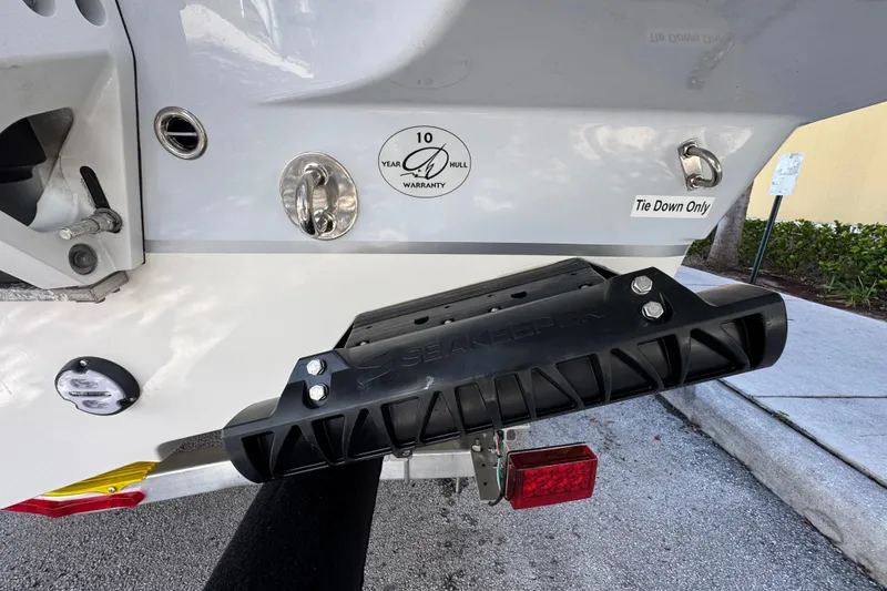 Slide: The Image of Sailfish 252 boat rear view with Seakeeper stabilizer, 10-year hull warranty badge, 2026 model. - 19