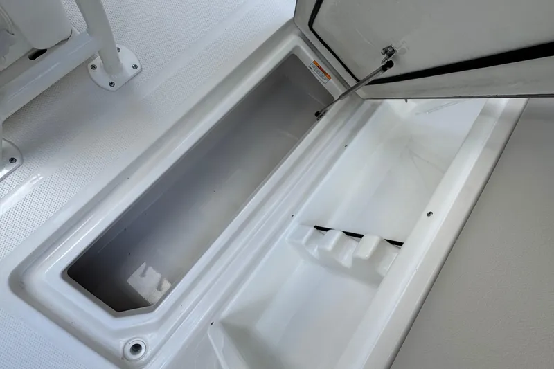 Slide: The Image of Open storage compartment on 2026 Sailfish 252 boat, showcasing spacious interior design. - 20