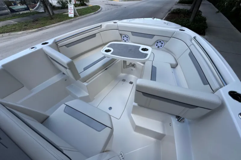 Slide: The Image of 2026 Sailfish 252 boat interior with spacious seating and table setup. - 6