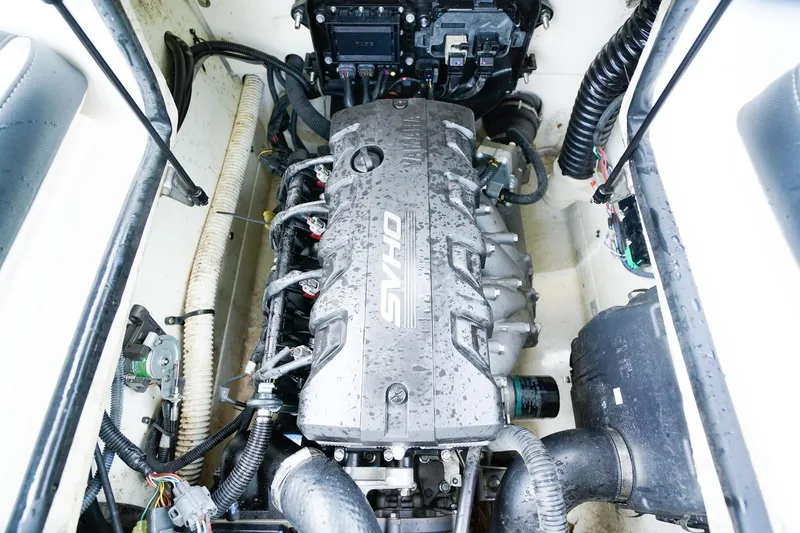 Slide: The Image of 2023 Yamaha Boats SX195 engine compartment with visible components and wiring. - 19