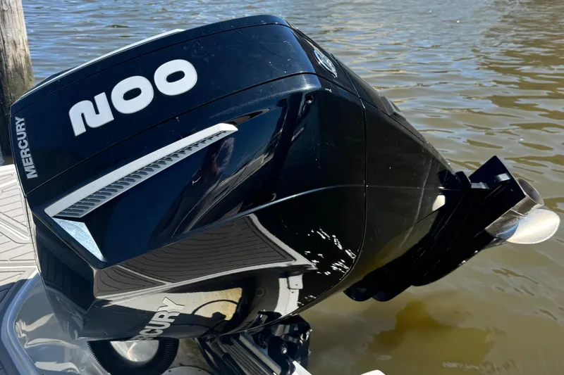 Slide: The Image of 2022 Crownline Eclipse E235 XS with Mercury outboard engine on water. - 11