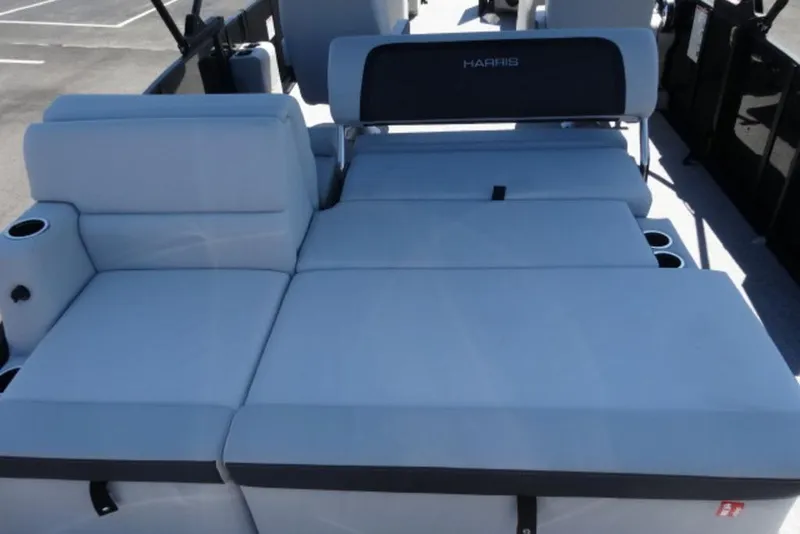 Slide: The Image of 2026 Harris Cruiser 230 Heritage boat interior with spacious seating and cup holders. - 13