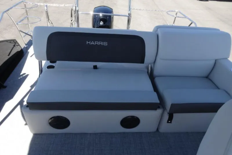 Slide: The Image of 2026 Harris Cruiser 230 Heritage boat seating with gray upholstery and black accents. - 15