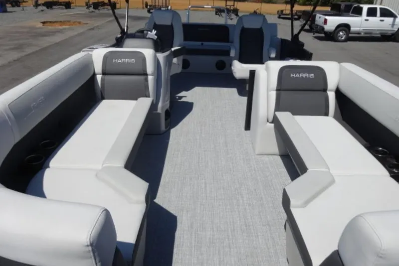 Slide: The Image of 2026 Harris Cruiser 230 Heritage pontoon boat interior with spacious seating and modern design. - 7