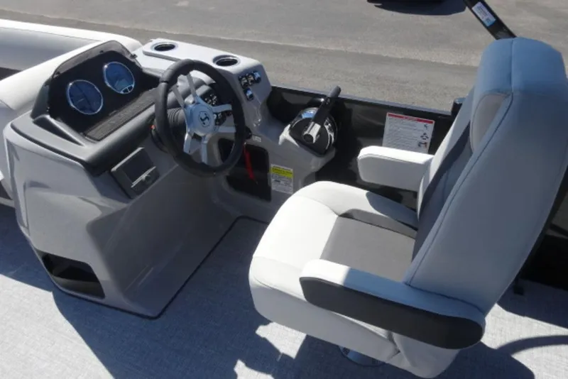 Slide: The Image of 2026 Harris Cruiser 230 Heritage boat cockpit with steering wheel and captain's chair. - 8