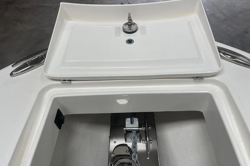 Slide: The Image of Anchor compartment of 2026 Regulator 31 boat, featuring a secure chain storage area. - 11