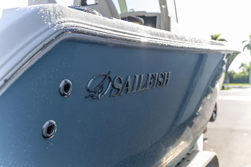 Slide: The Image of 2022 Sailfish 272 CC boat interior with cushioned seating and storage compartments. - 3