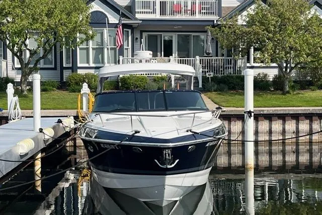 Slide: The Image of 2021 Formula 350 Sun Sport docked in front of a waterfront home. - 1