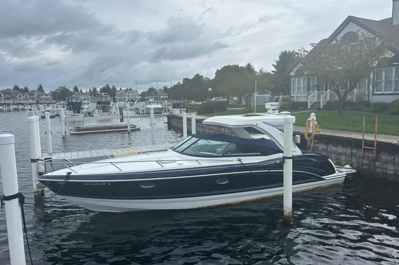 Slide: The Image of 2021 Formula 350 Sun Sport docked at a marina with overcast skies. - 10