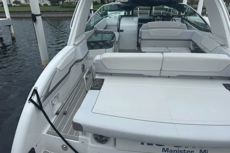 Slide: The Image of 2021 Formula 350 Sun Sport boat with spacious seating and sleek design, docked in Manistee, MI. - 13