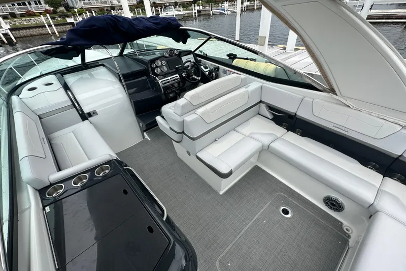 Slide: The Image of 2021 Formula 350 Sun Sport boat interior with luxurious seating and modern dashboard. - 15