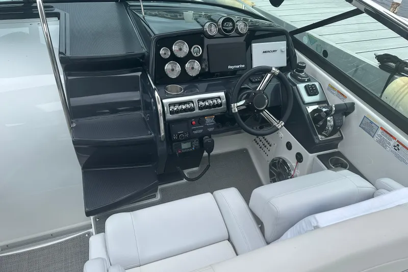 Slide: The Image of 2021 Formula 350 Sun Sport boat cockpit with modern steering and control panel. - 20