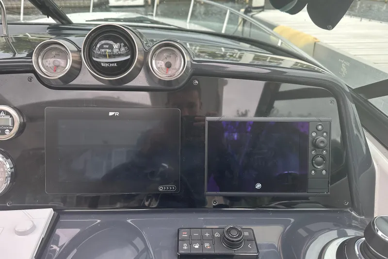 Slide: The Image of Dashboard of a 2021 Formula 350 Sun Sport boat with navigation instruments. - 24