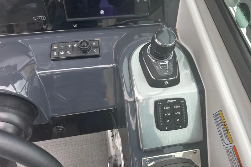 Slide: The Image of Control panel of 2021 Formula 350 Sun Sport boat with joystick and buttons. - 25
