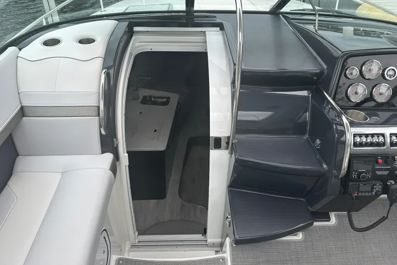 Slide: The Image of 2021 Formula 350 Sun Sport boat interior with cabin entrance and control panel. - 28
