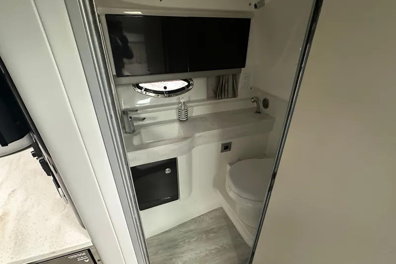 Slide: The Image of 2021 Formula 350 Sun Sport bathroom with modern sink, toilet, and storage. - 33