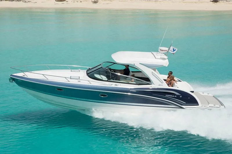 Slide: The Image of Manufacturer Provided Image: 2021 Formula 350 Sun Sport boat cruising in clear turquoise water. - 48