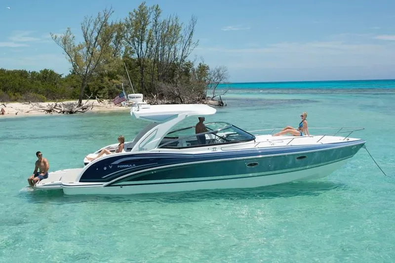 Slide: The Image of Manufacturer Provided Image: 2021 Formula 350 Sun Sport boat cruising in clear turquoise waters near a tropical island. - 53
