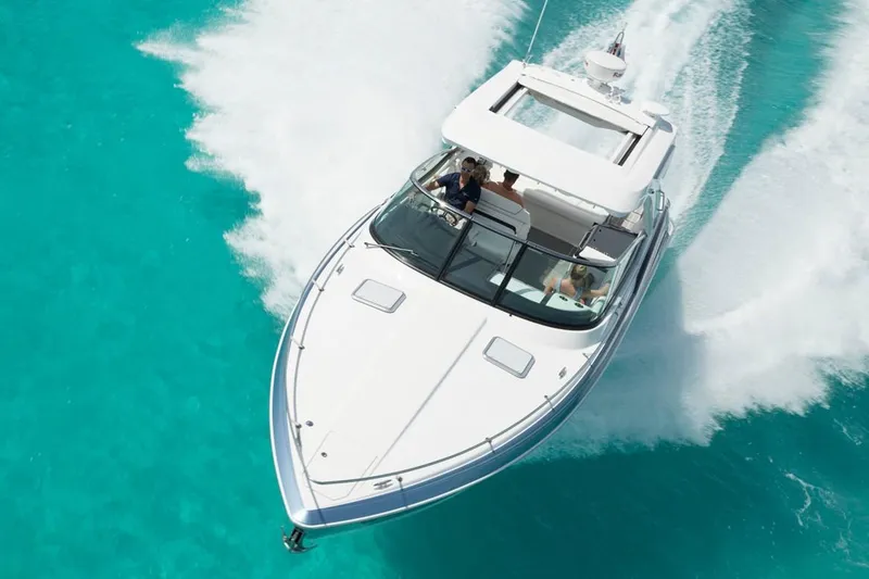 Slide: The Image of Manufacturer Provided Image: 2021 Formula 350 Sun Sport cruising on clear turquoise water. - 55