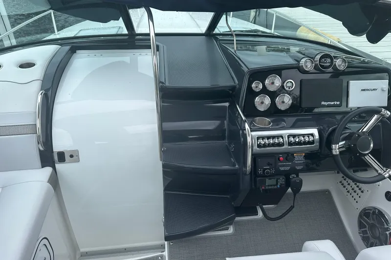 Slide: The Image of 2021 Formula 350 Sun Sport cockpit with modern controls and navigation equipment. - 75