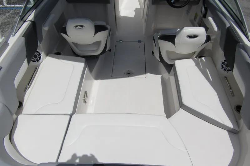 Slide: The Image of 2022 Chaparral 23 SSi boat interior with white seating and modern design. - 33