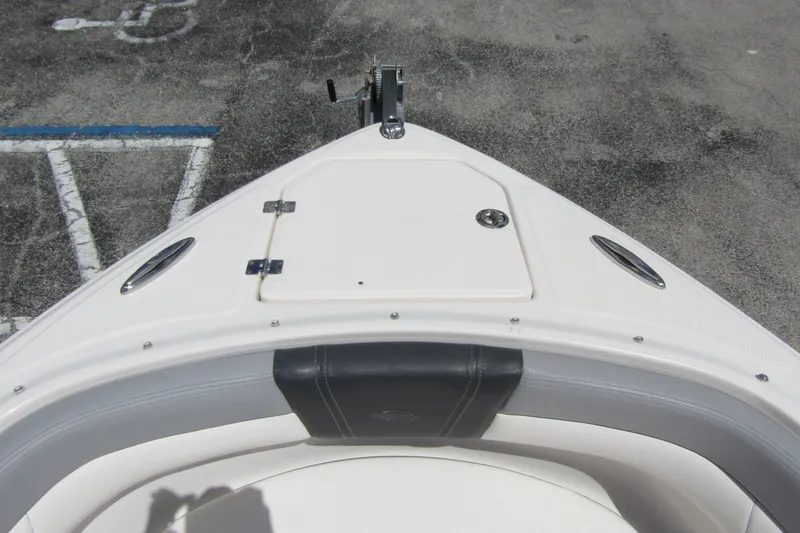 Slide: The Image of Bow view of 2022 Chaparral 23 SSi boat with seating and storage compartment. - 6