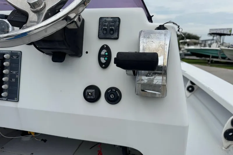 Slide: The Image of 2006 Majek 22 Extreme boat dashboard with steering wheel and control panel. - 15
