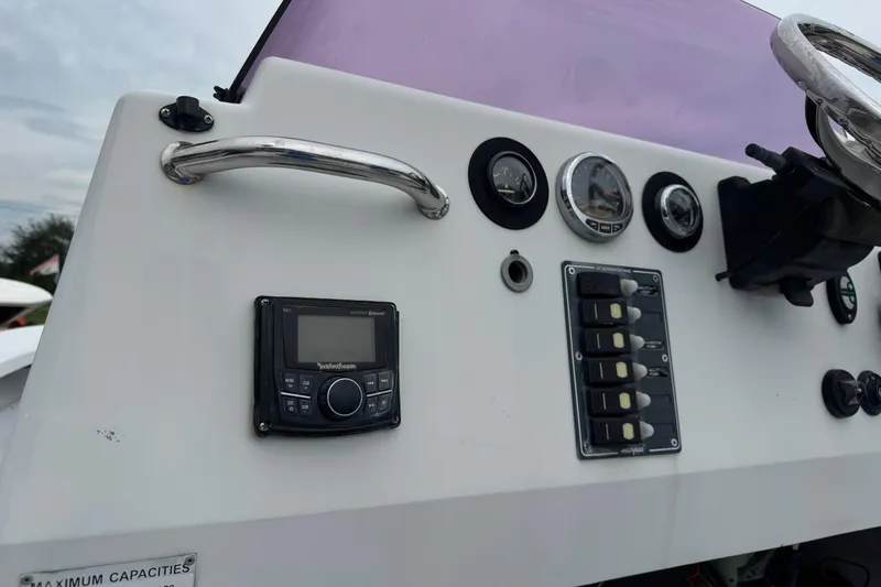 Slide: The Image of Control panel of a 2006 Majek 22 Extreme boat with gauges and switches. - 17