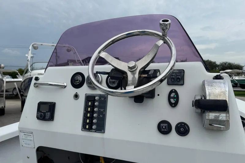 Slide: The Image of 2006 Majek 22 Extreme boat console with steering wheel and controls. - 19