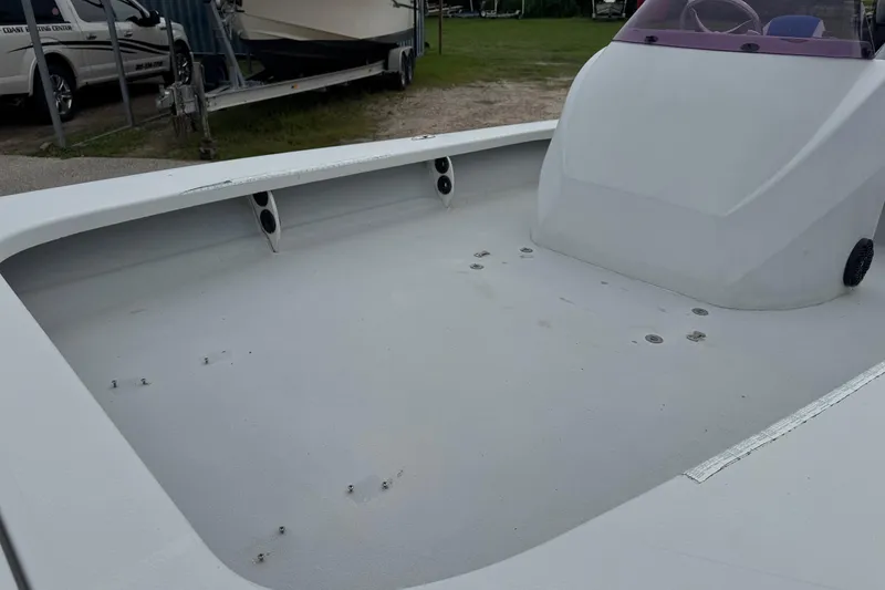 Slide: The Image of 2006 Majek 22 Extreme boat interior, showcasing spacious deck and console design. - 6