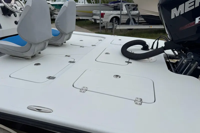 Slide: The Image of 2006 Majek 22 Extreme boat deck with seats and Mercury engine. - 8