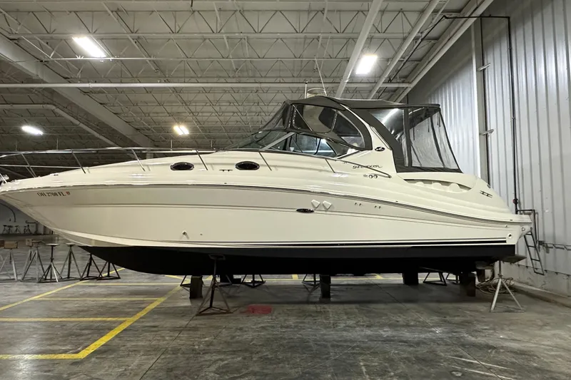 The Image of 2004 Sea Ray 340 Sundancer yacht in indoor storage, side view. - 0