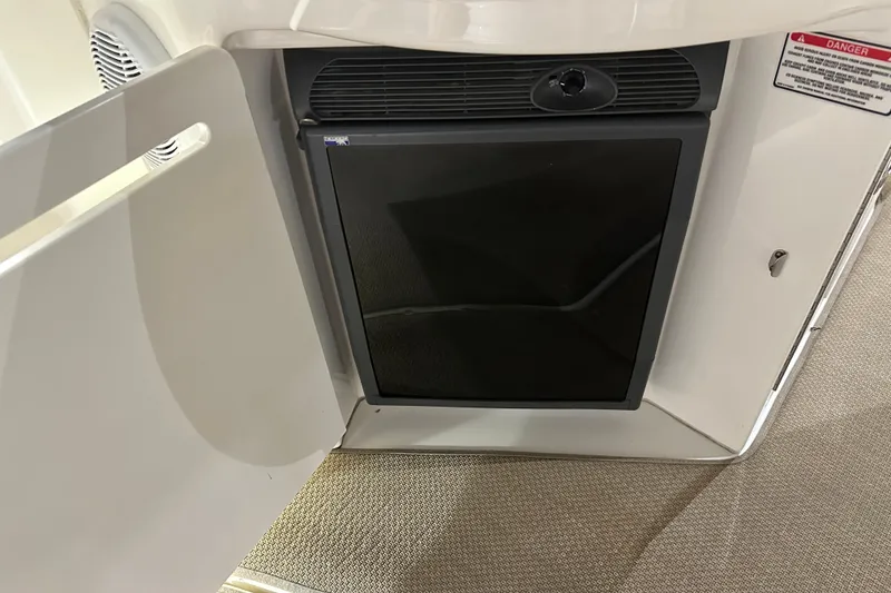 Slide: The Image of Mini fridge inside 2004 Sea Ray 340 Sundancer boat, with open cabinet door. - 12