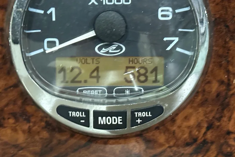 Slide: The Image of Gauge display on 2004 Sea Ray 340 Sundancer showing 12.4 volts and 581 hours. - 23
