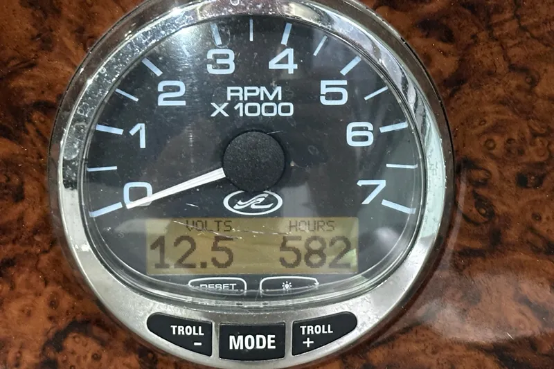 Slide: The Image of Tachometer of 2004 Sea Ray 340 Sundancer showing 12.5 volts and 582 hours. - 24
