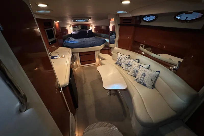 Slide: The Image of Luxurious interior of 2004 Sea Ray 340 Sundancer yacht with cozy seating and elegant decor. - 26