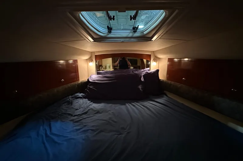 Slide: The Image of Cozy cabin interior of 2004 Sea Ray 340 Sundancer with skylight and ambient lighting. - 40